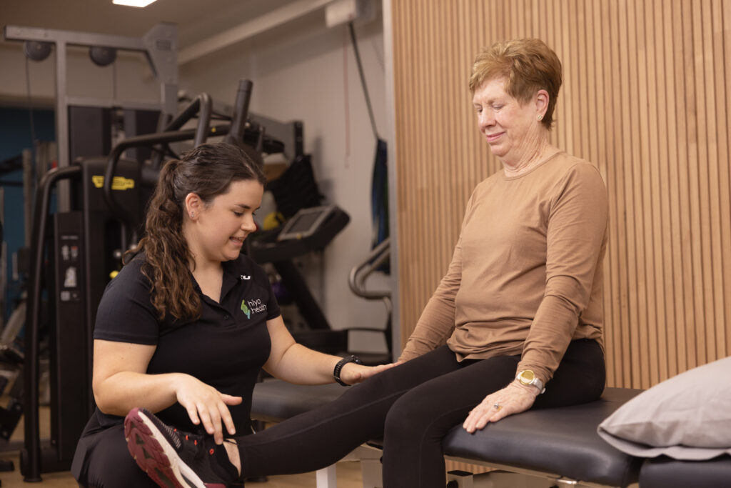 Female physiotherapist with mature client jessica beard