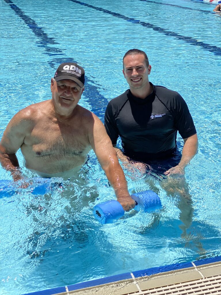 Hydrotherapy in pool with physio