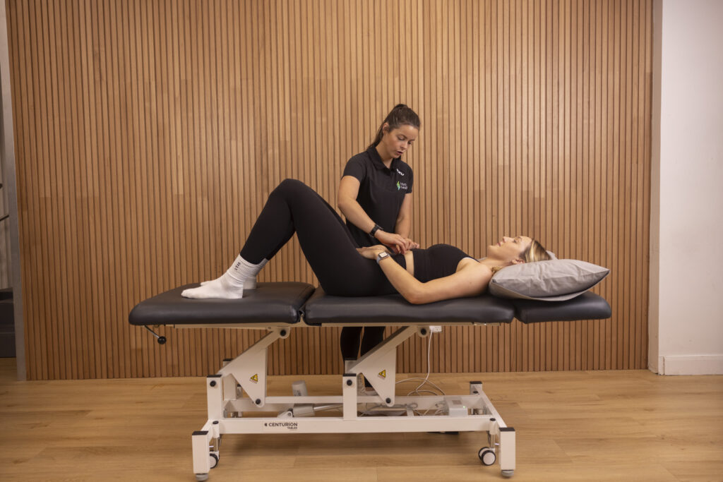 Woman getting manual therapy with a physiotherapist