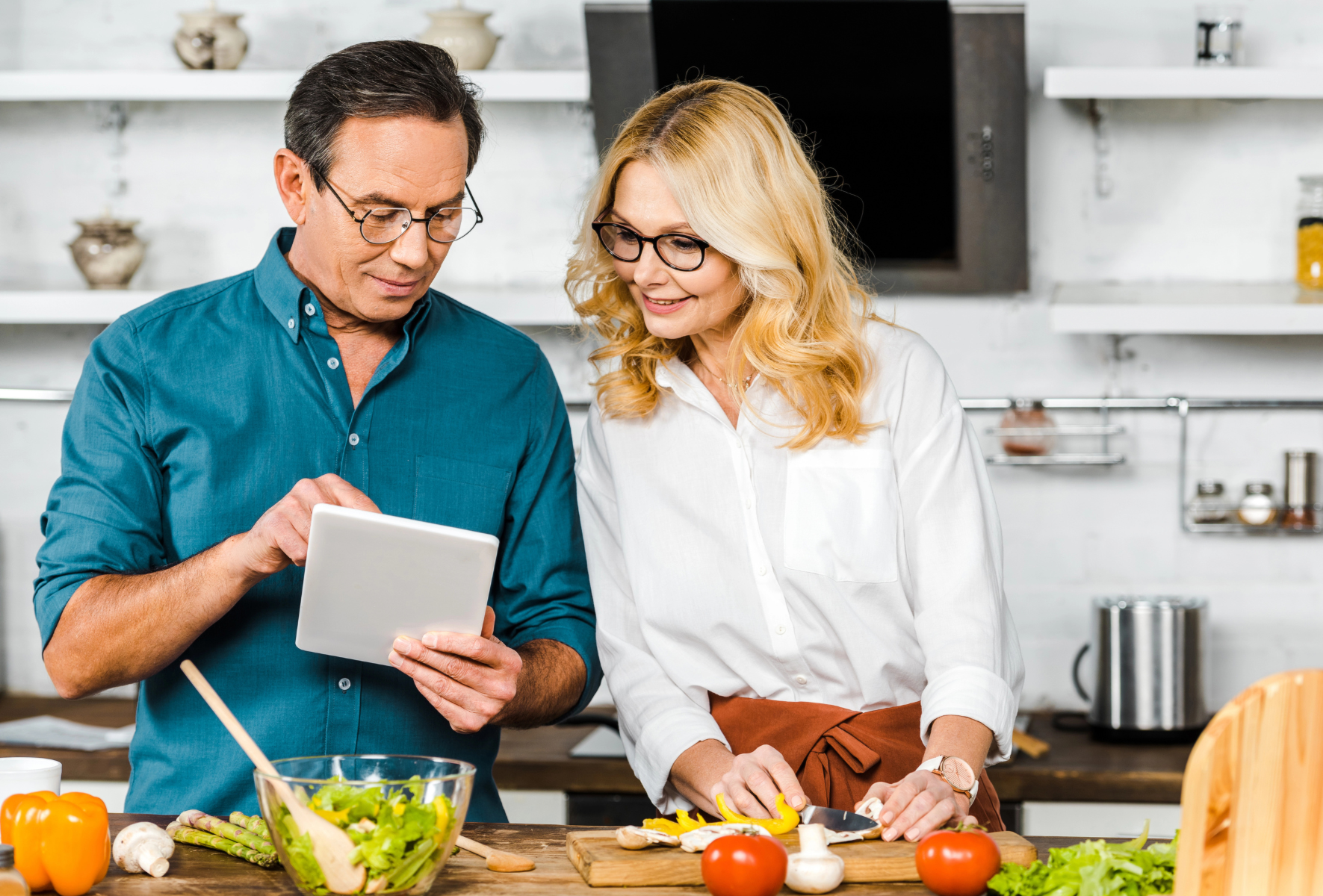 male showing female in kitchen healthy dietary options