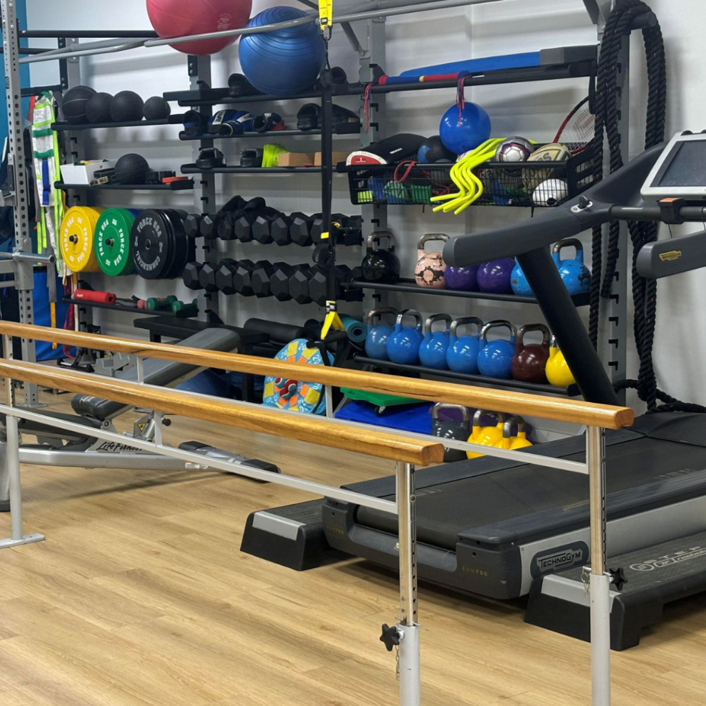 parallel bars and treadmill in gym