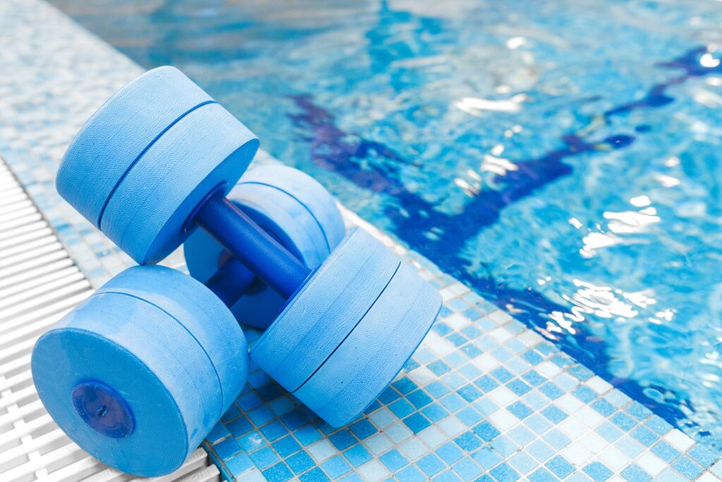 hydrotherapy weights beside a pool