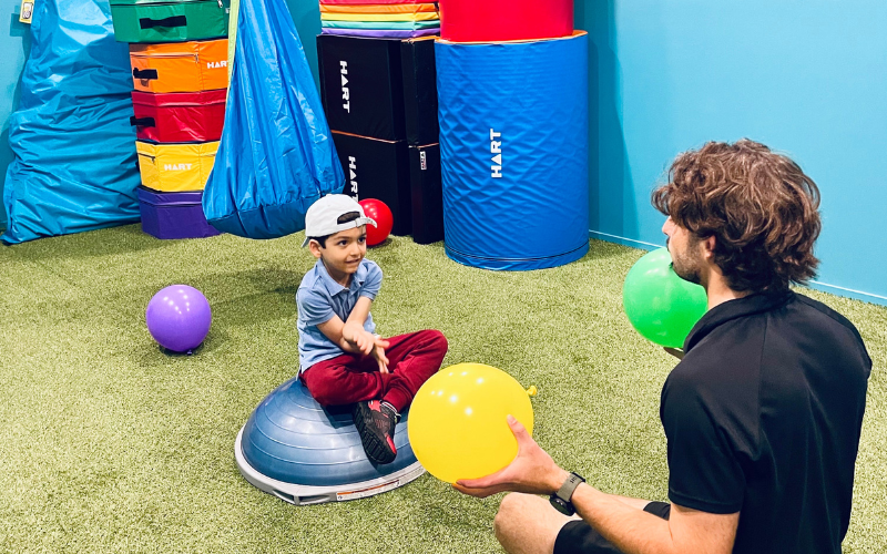 EP working with balloons with boy